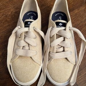Brand new gold Sperry sneaker.